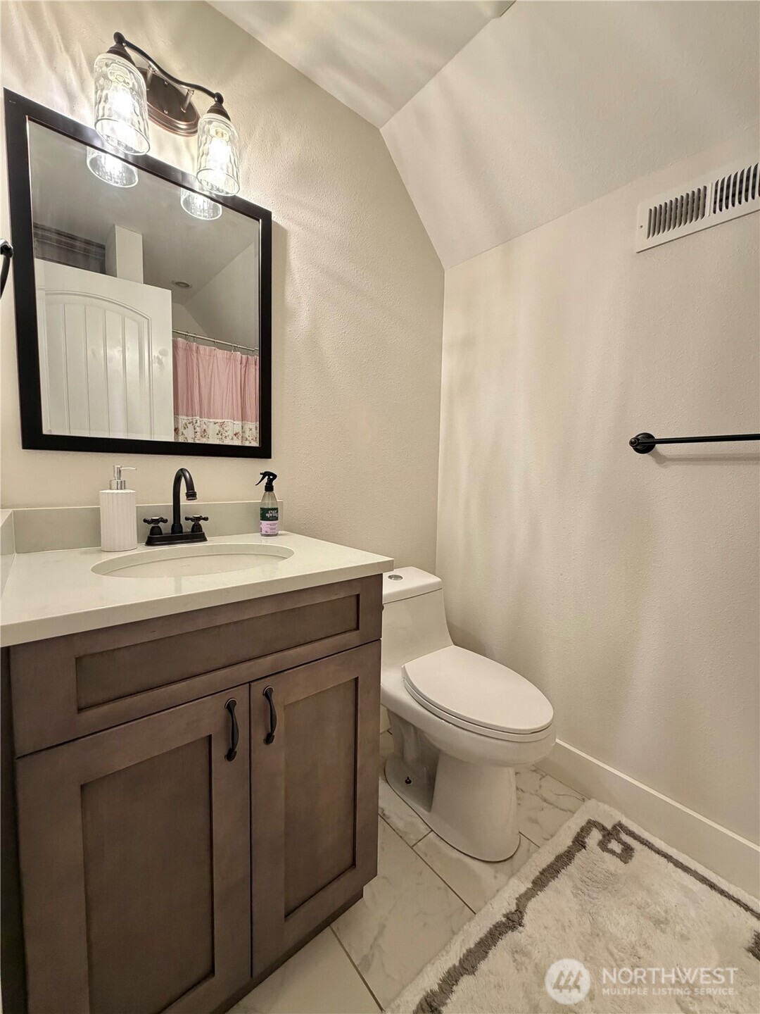 18349 Northwest Stavis Bay Road Seabeck, WA 98380 - Photo 33 of 40 a bathroom with a toilet sink and mirror