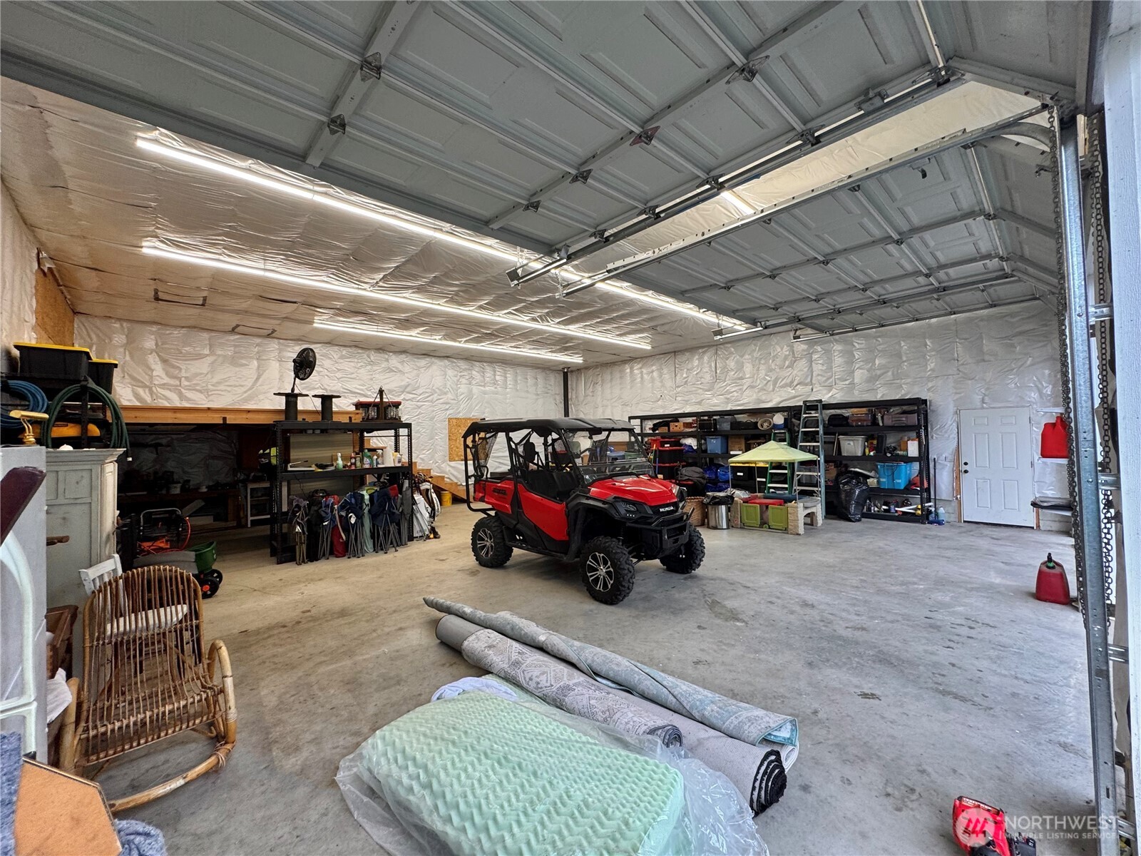 18349 Northwest Stavis Bay Road Seabeck, WA 98380 - Photo 36 of 40 a view of parking garage with cars and other equipment