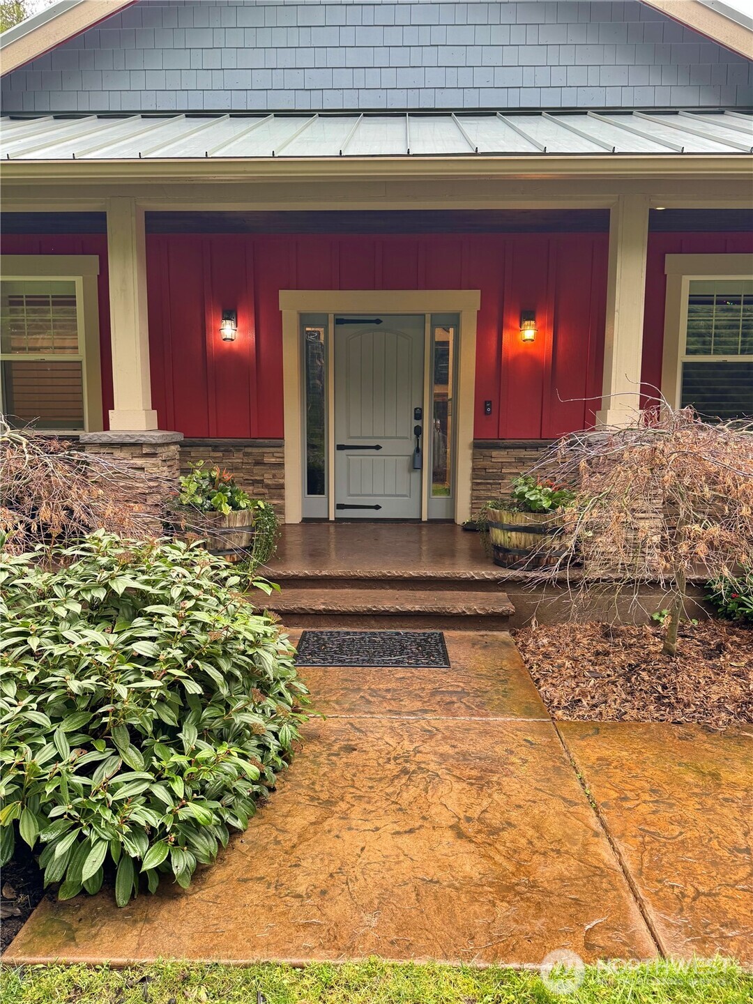 18349 Northwest Stavis Bay Road Seabeck, WA 98380 - Photo 5 of 40 a front view of a house with a yard
