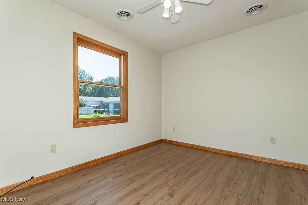 2811 Russell Road Ashtabula, OH 44004 - Photo 20 of 42 Generously sized bedroom #2 with vinyl flooring