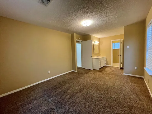 a bathroom with a double vanity sink a mirror and a bathtub