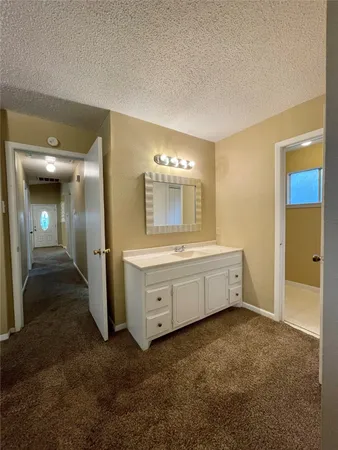 a white toilet sitting next to a bathroom sink