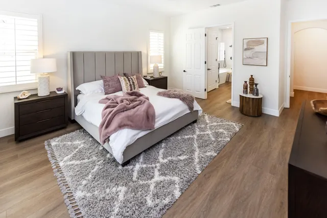 a view of a livingroom with furniture and a floor to ceiling window