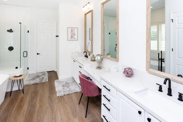a front view of a house with garden bath tub and couches chair
