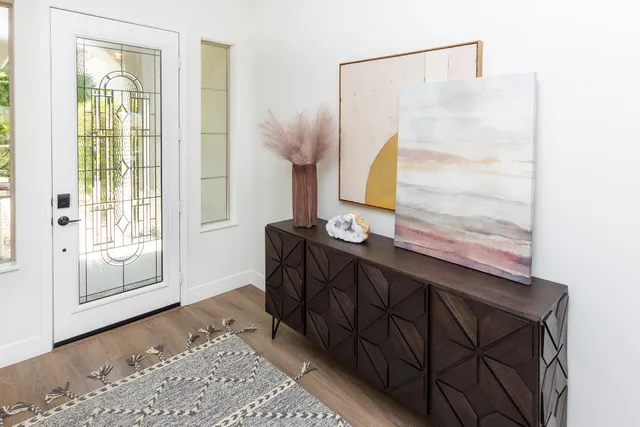a bathroom with a tub shower and sink