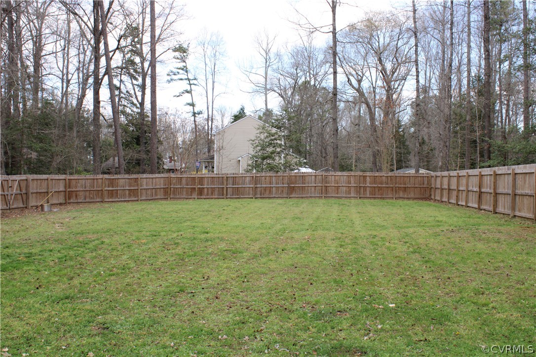 5311 North Courthouse Road Providence Forge, VA 23140 - Photo 11 of 49 a view of yard and trees in the background