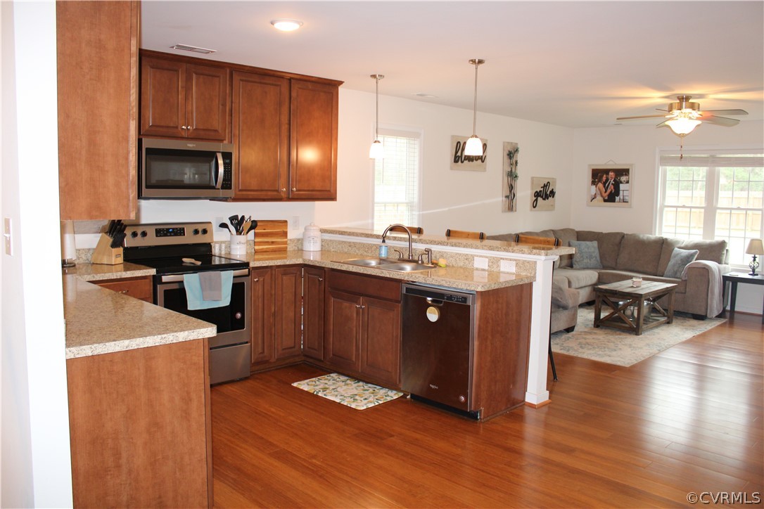 5311 North Courthouse Road Providence Forge, VA 23140 - Photo 20 of 49 a kitchen with a sink stove and wooden cabinets