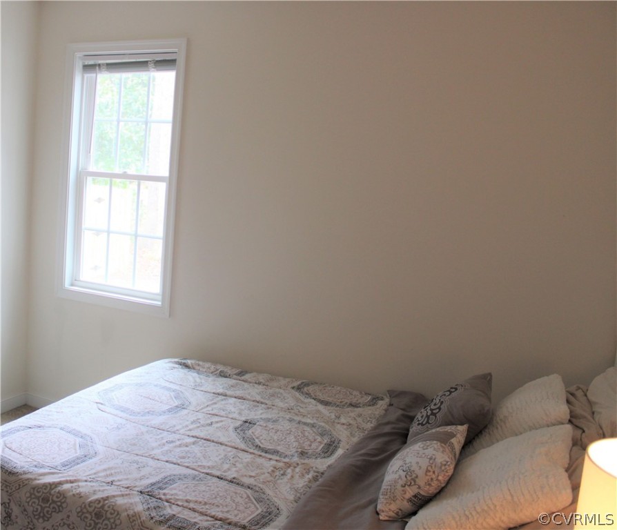 5311 North Courthouse Road Providence Forge, VA 23140 - Photo 33 of 49 a bed sitting in a bedroom next to a window