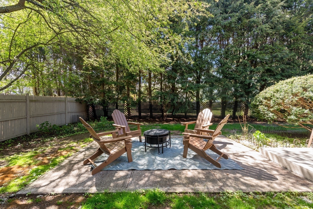 50 Mary Ellen Road Newton, MA 02468 - Photo 19 of 22 a view of a chair and tables in the backyard