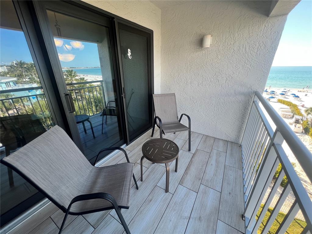 1001 Point Of Rocks Road, Unit 512 Sarasota, FL 34242 - Photo 11 of 44 a view of a hallway with furniture and front door