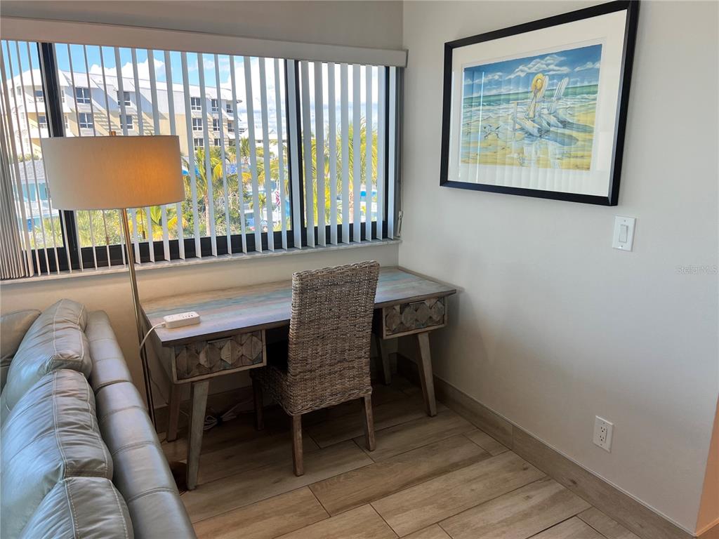 1001 Point Of Rocks Road, Unit 512 Sarasota, FL 34242 - Photo 18 of 44 a dining room with furniture and a window
