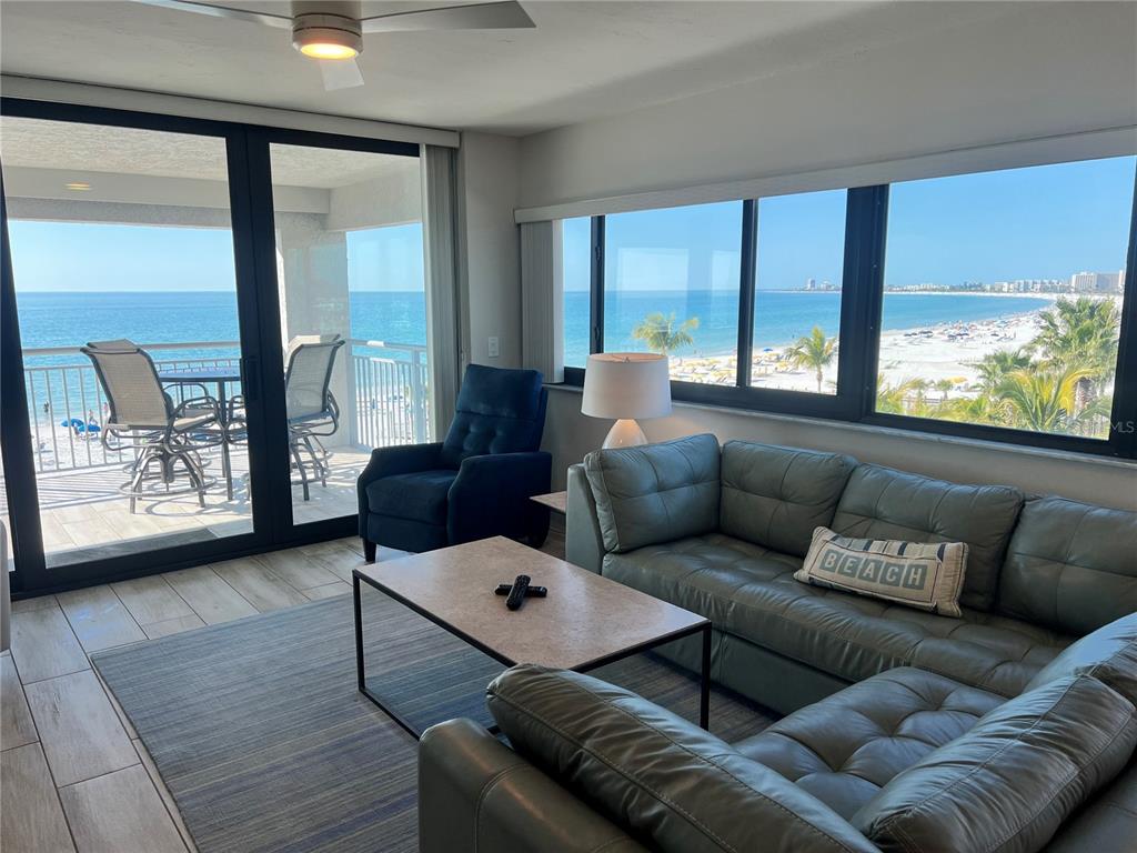 1001 Point Of Rocks Road, Unit 512 Sarasota, FL 34242 - Photo 2 of 44 a living room with furniture and large windows