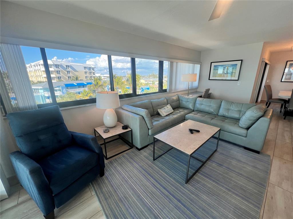 1001 Point Of Rocks Road, Unit 512 Sarasota, FL 34242 - Photo 3 of 44 a living room with furniture and a large window