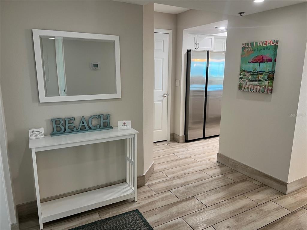 1001 Point Of Rocks Road, Unit 512 Sarasota, FL 34242 - Photo 5 of 44 a bathroom with a sink and a mirror