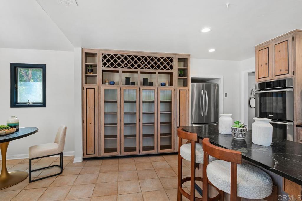 455 Cole Ranch Road Encinitas, CA 92024 - Photo 13 of 43 a dining room with furniture and a window