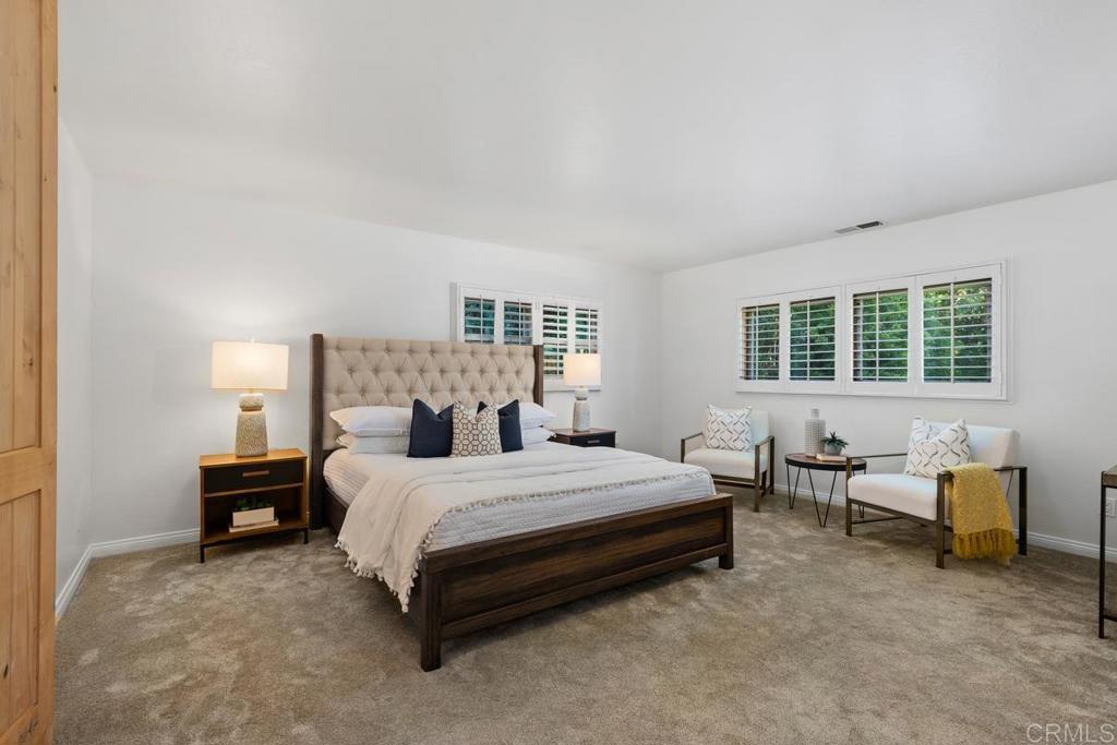 455 Cole Ranch Road Encinitas, CA 92024 - Photo 17 of 43 a bedroom with a bed and a chair