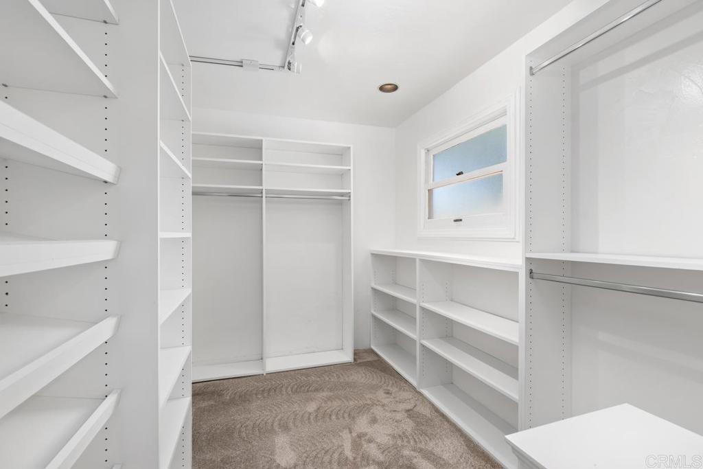 455 Cole Ranch Road Encinitas, CA 92024 - Photo 20 of 43 a view of walk in closet with empty racks
