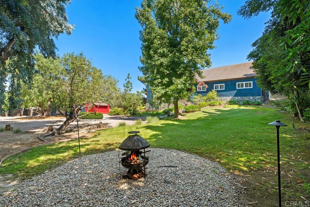 455 Cole Ranch Road Encinitas, CA 92024 - Photo 40 of 43 a view of backyard with a garden and entertaining space