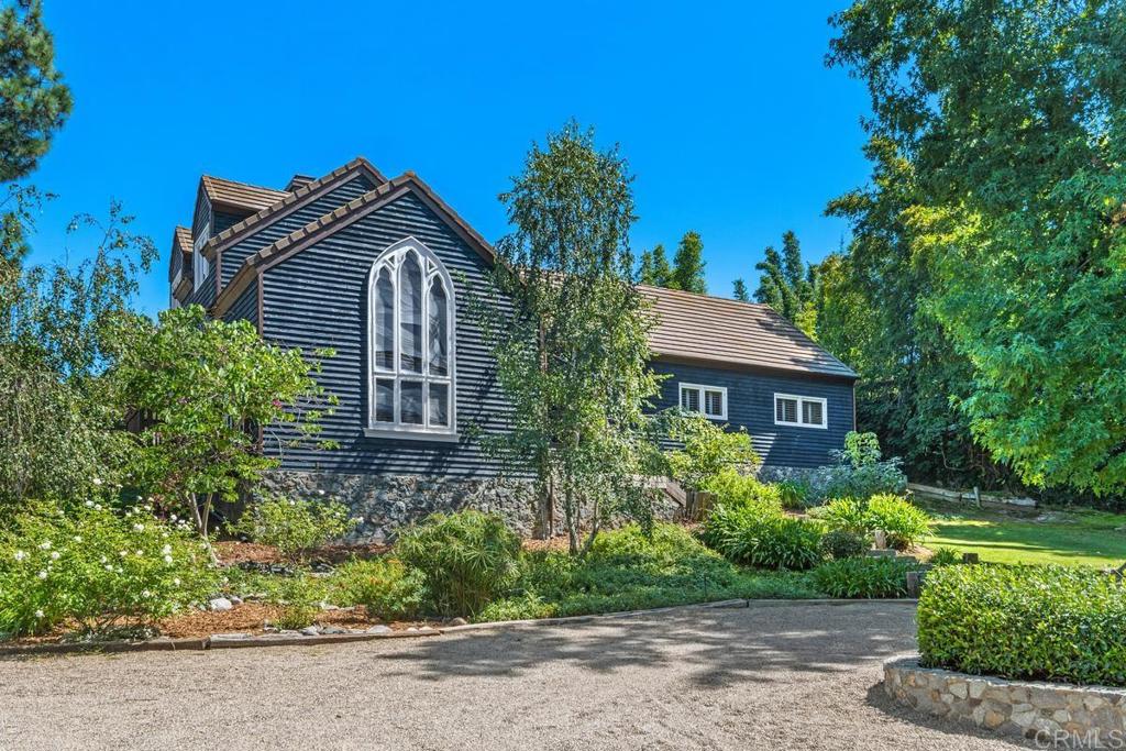 455 Cole Ranch Road Encinitas, CA 92024 - Photo 7 of 43 a front view of a house with a yard