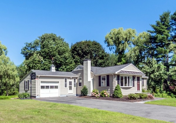 208 Haggetts Pond Road Andover, MA 01810 - Photo 2 of 23 a front view of a house with a garden