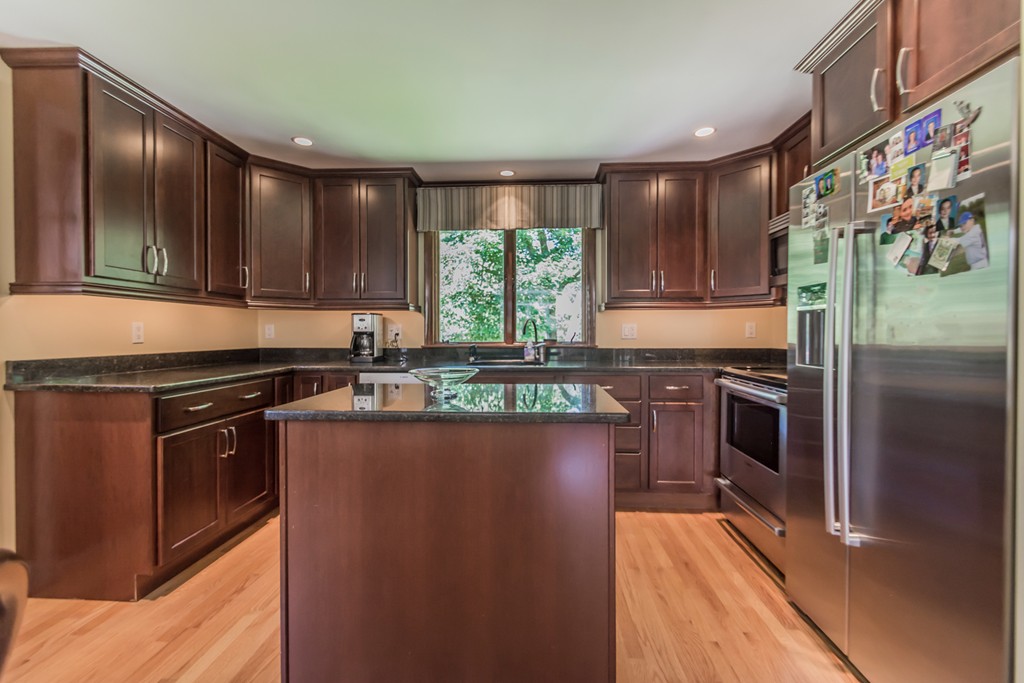 208 Haggetts Pond Road Andover, MA 01810 - Photo 4 of 23 a kitchen with stainless steel appliances granite countertop a stove a sink and a refrigerator