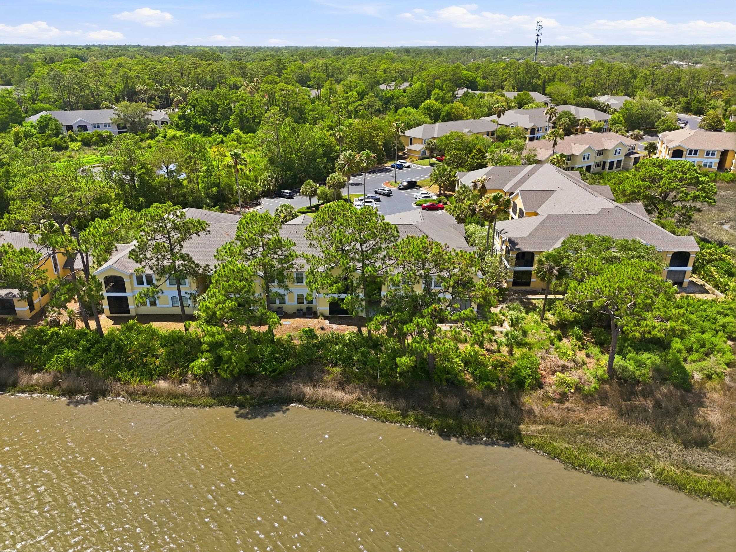 2500 Vista Cove Road St. Augustine, FL 32084 - Photo 51 of 53 a view of a green yard with houses
