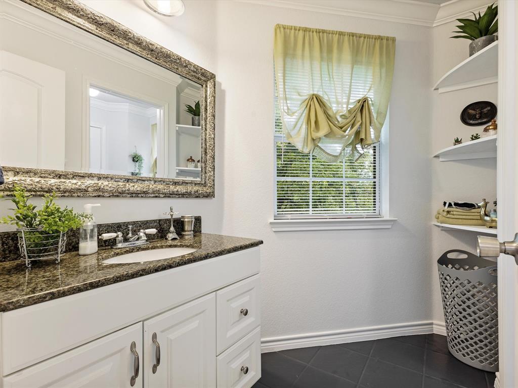 1514 New Market Road Mesquite, TX 75149 - Photo 15 of 30 a bathroom with a granite countertop sink and a mirror