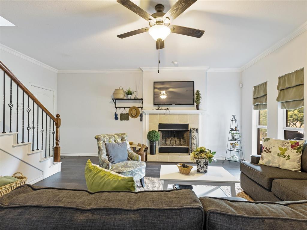 1514 New Market Road Mesquite, TX 75149 - Photo 18 of 30 a living room with furniture a fireplace and a flat screen tv