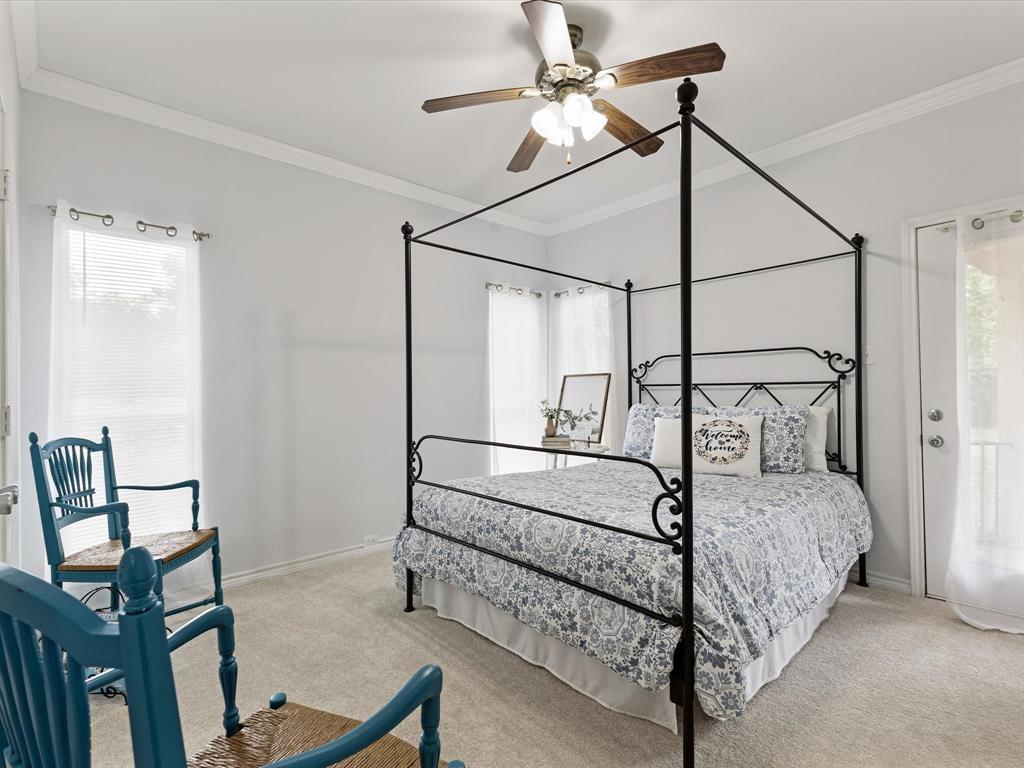 1514 New Market Road Mesquite, TX 75149 - Photo 19 of 30 a bedroom with a bed a rug and wooden floor