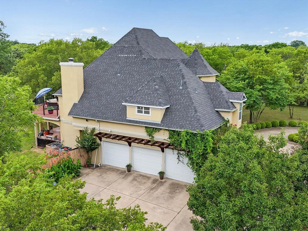 1514 New Market Road Mesquite, TX 75149 - Photo 28 of 30 an aerial view of a house with a yard and a garage