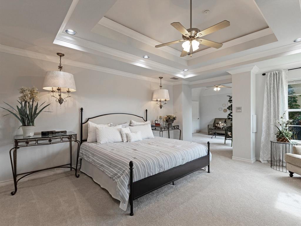 1514 New Market Road Mesquite, TX 75149 - Photo 7 of 30 a bedroom with a large bed couch and a chandelier