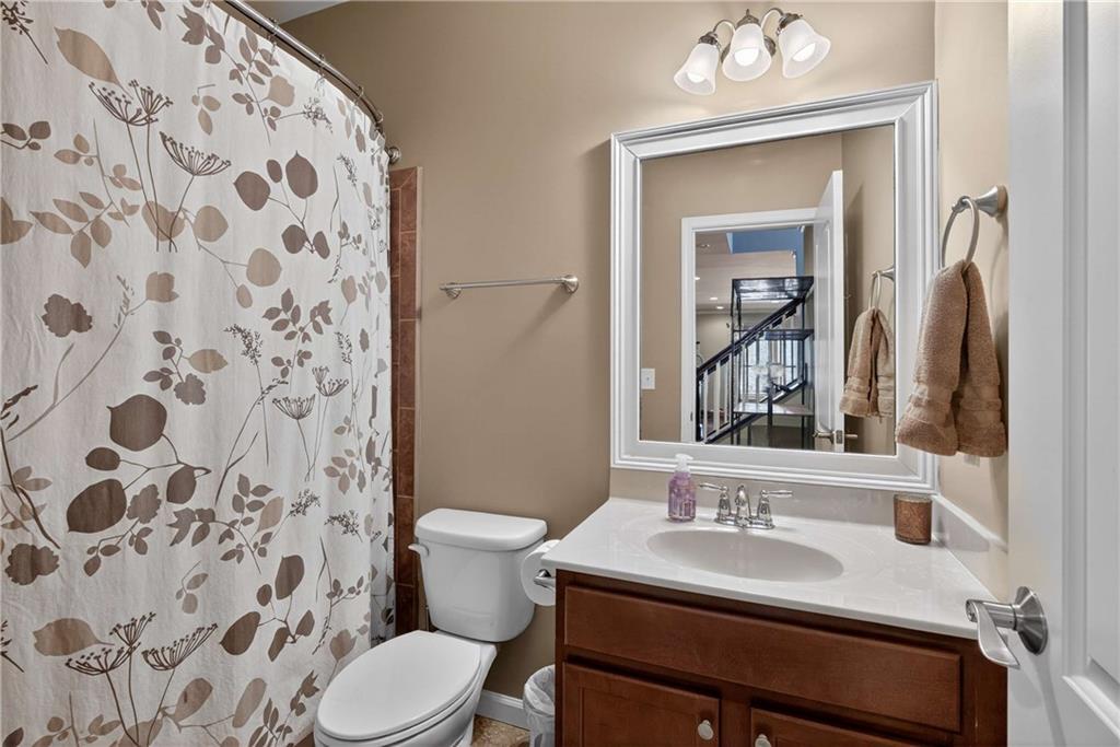 340 Scott Farm Drive Powder Springs, GA 30127 - Photo 41 of 59 a bathroom with a sink and a mirror