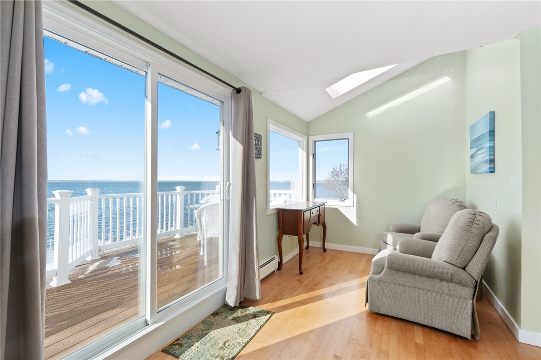 19 Brookwood Road Bristol, RI 02809 - Photo 22 of 46 Slider and balcony in master bedroom with nook