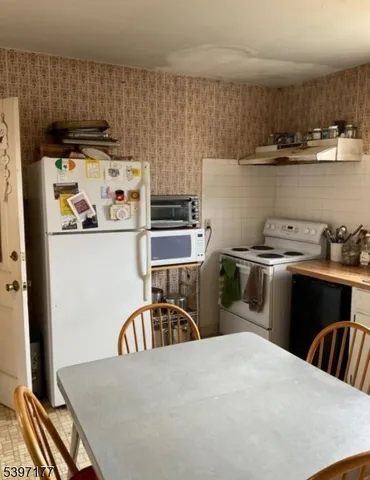 a view of staircase with wooden floor and a window