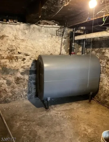 a living room with furniture fireplace and a window