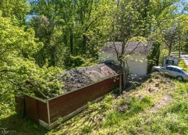 a view of house with backyard