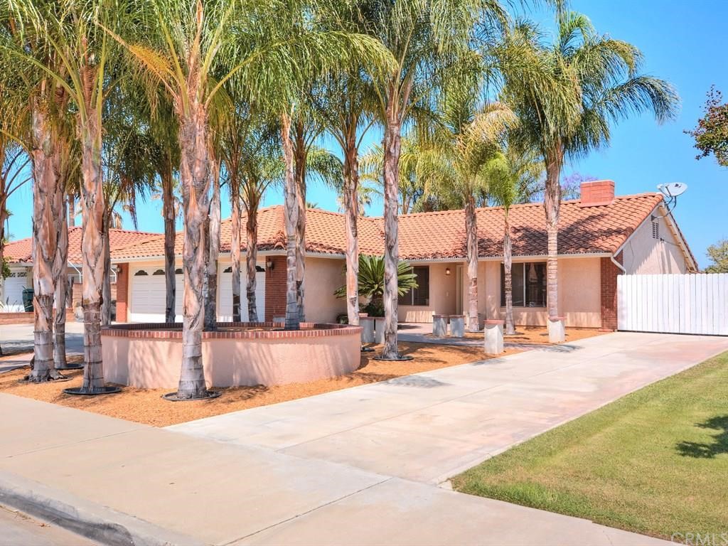 6675 Fairchild Drive Riverside, CA 92506 - Photo 1 of 1 Shaded front yard with 14 queen Palms. The extra deep RV space starts & continues behind the right side gate. The behind the gate continues to the rear fence.