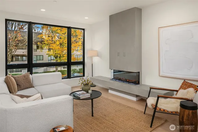 a living room with furniture and a large window