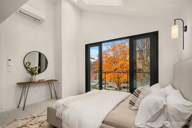 a bedroom with a bed and window