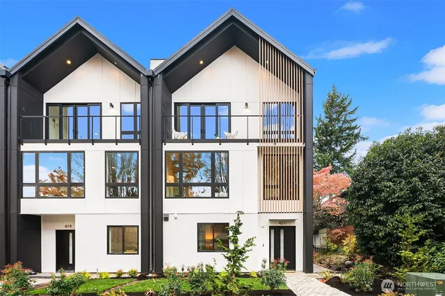 a view of a brick house with windows and yard