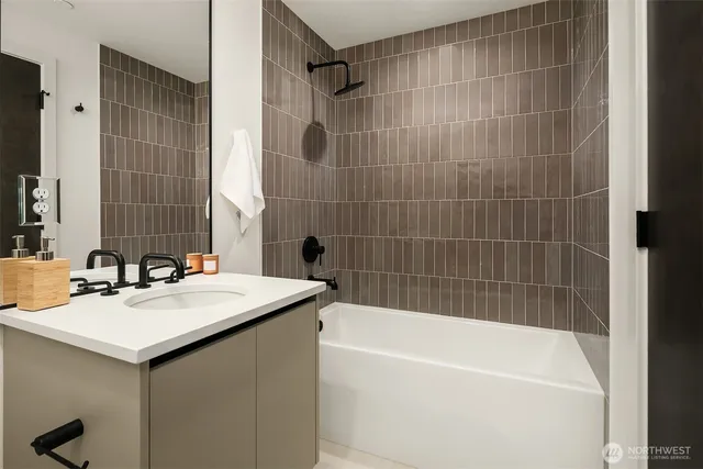 a bathroom with a bathtub and a sink