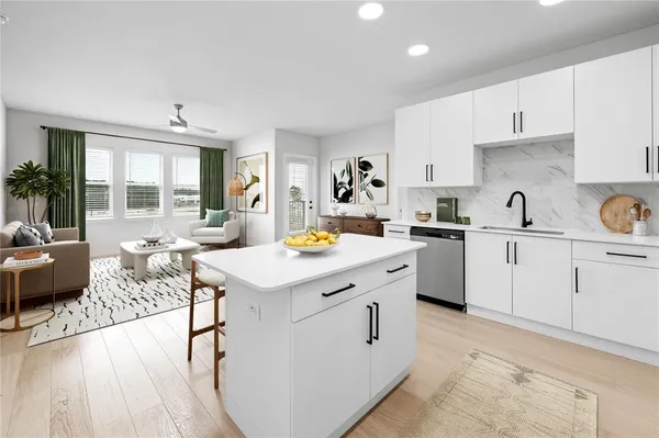 a kitchen with a sink stove and cabinets