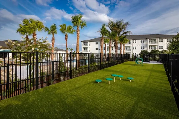 a view of a house with backyard and a patio