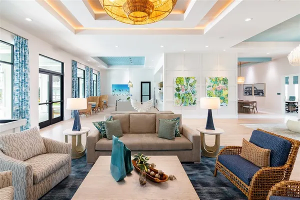 a living room with furniture or couch and a large window