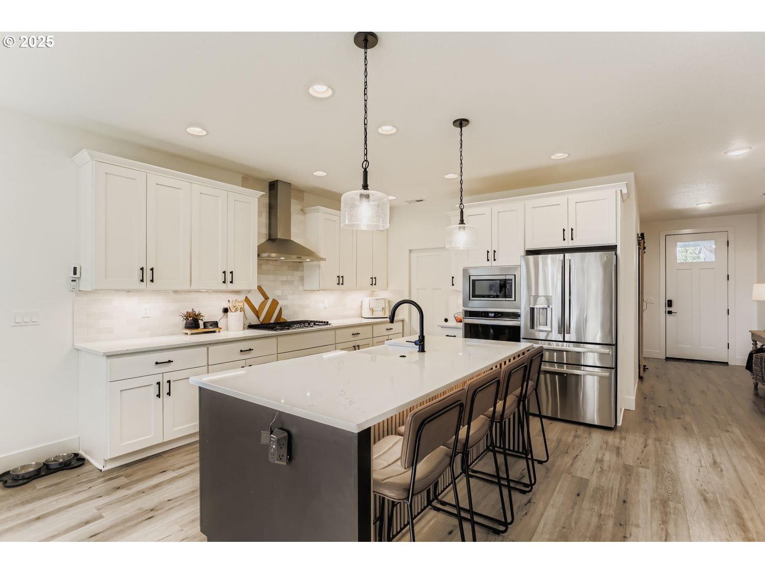 3651 Tiana Street Forest Grove, OR 97116 - Photo 11 of 27 a kitchen with kitchen island a sink stainless steel appliances and cabinets