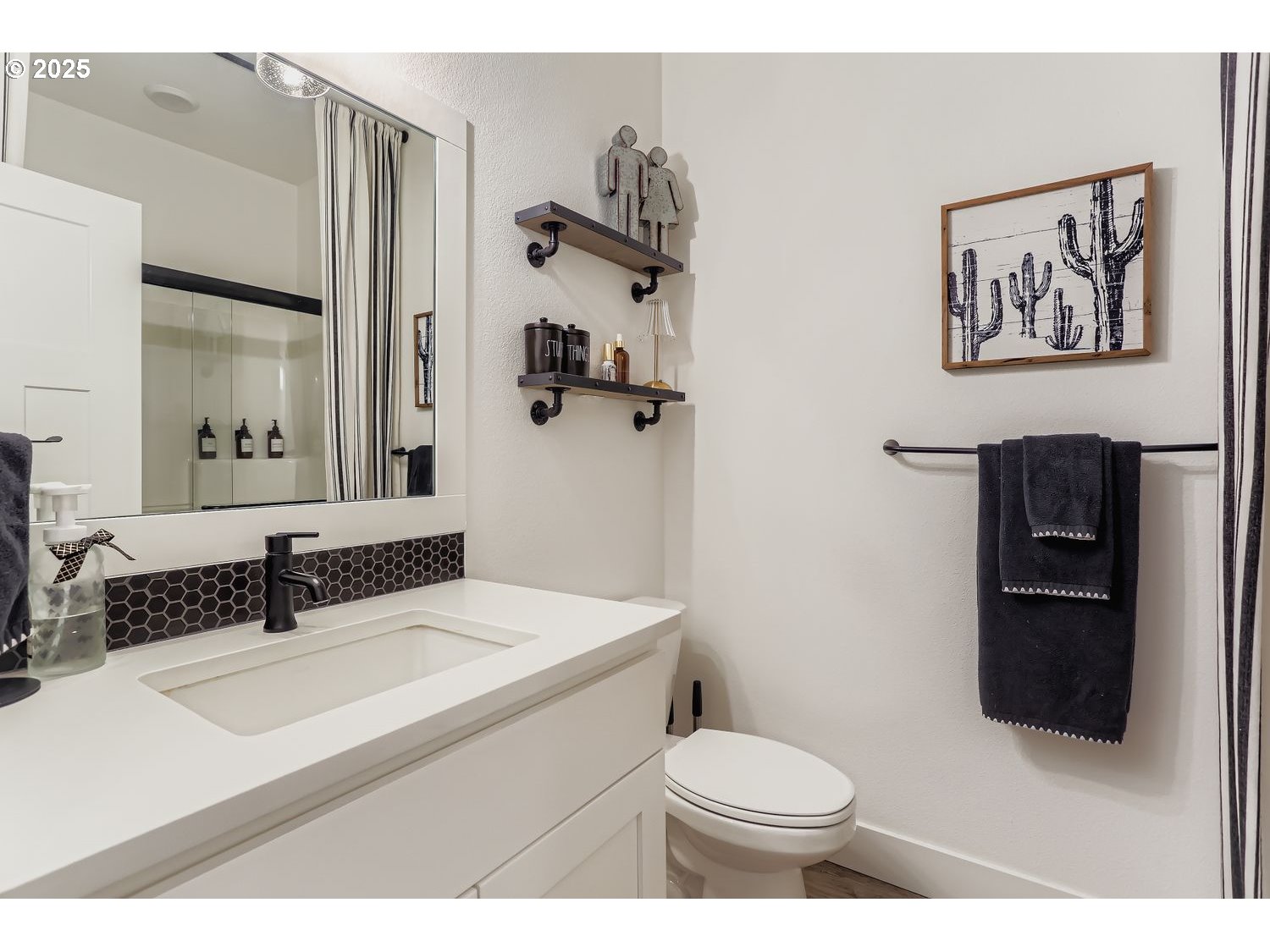 3651 Tiana Street Forest Grove, OR 97116 - Photo 15 of 27 a bathroom with a sink toilet and a mirror