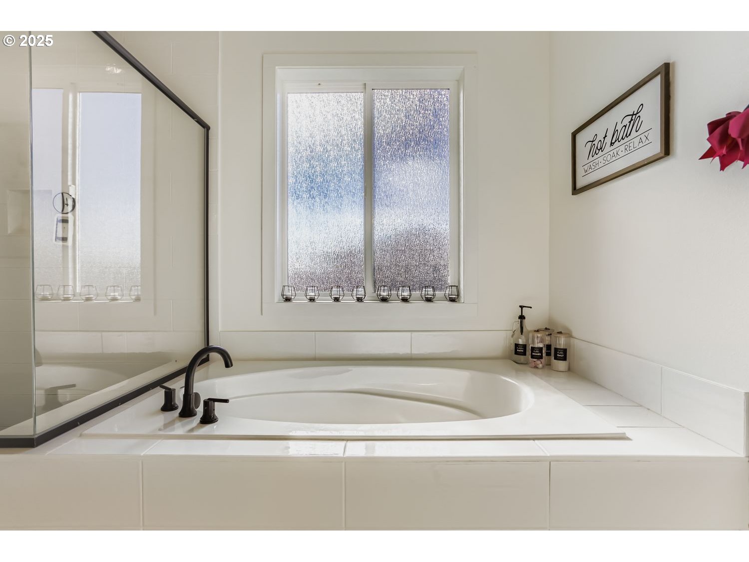 3651 Tiana Street Forest Grove, OR 97116 - Photo 19 of 27 a bathroom with a tub a sink and a mirror