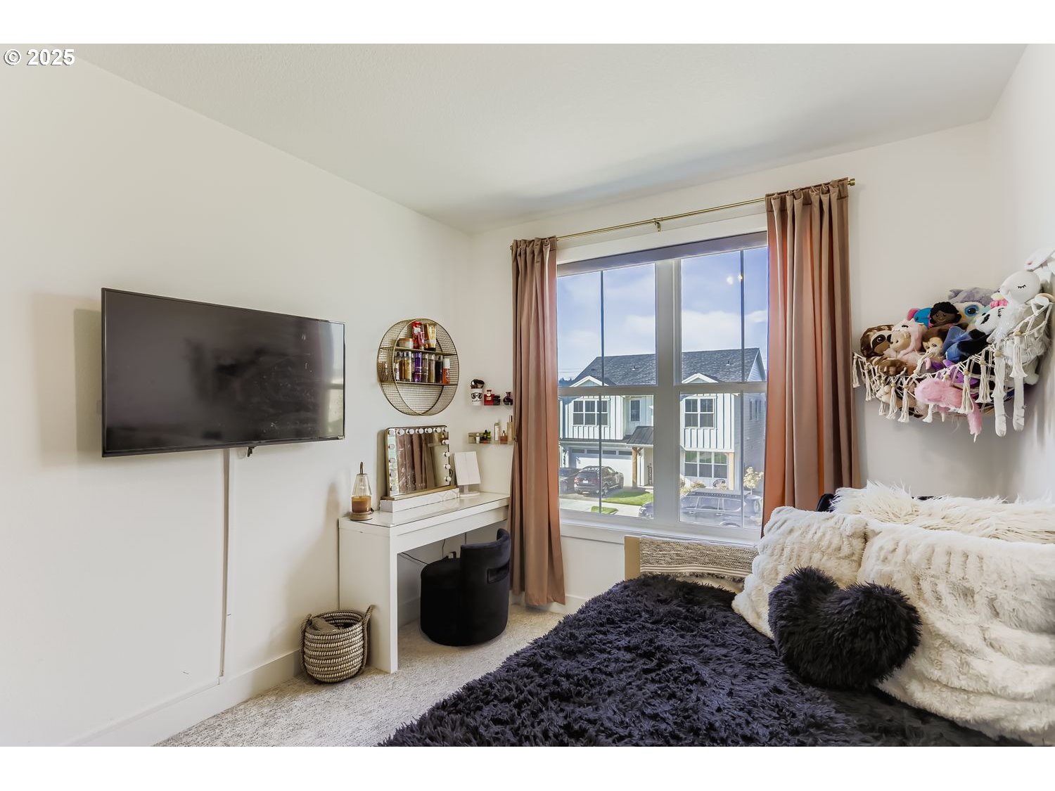 3651 Tiana Street Forest Grove, OR 97116 - Photo 21 of 27 a living room with furniture and a flat screen tv