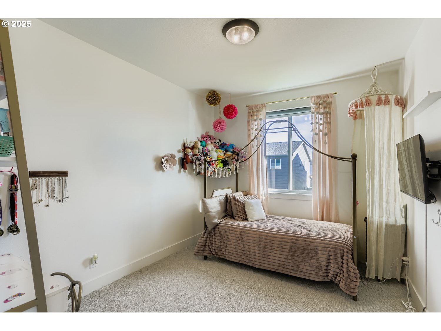 3651 Tiana Street Forest Grove, OR 97116 - Photo 22 of 27 a bedroom with furniture and a flat screen tv