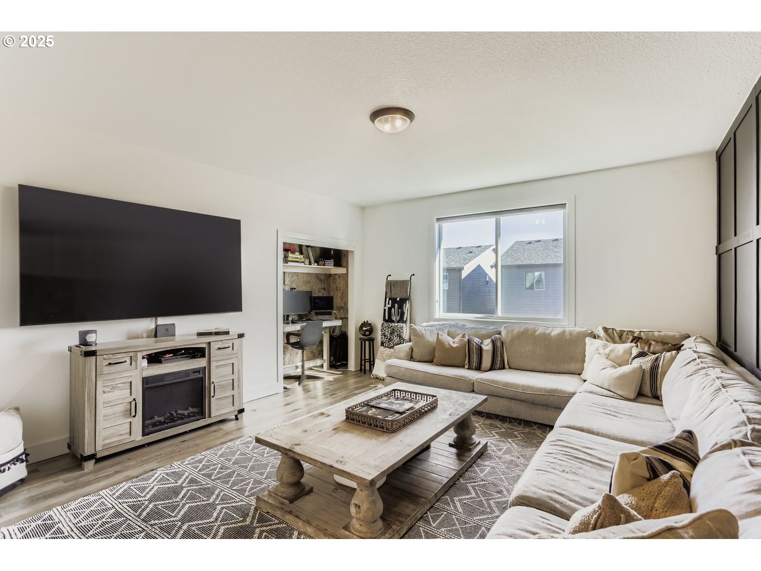 3651 Tiana Street Forest Grove, OR 97116 - Photo 24 of 27 a living room with furniture and a flat screen tv